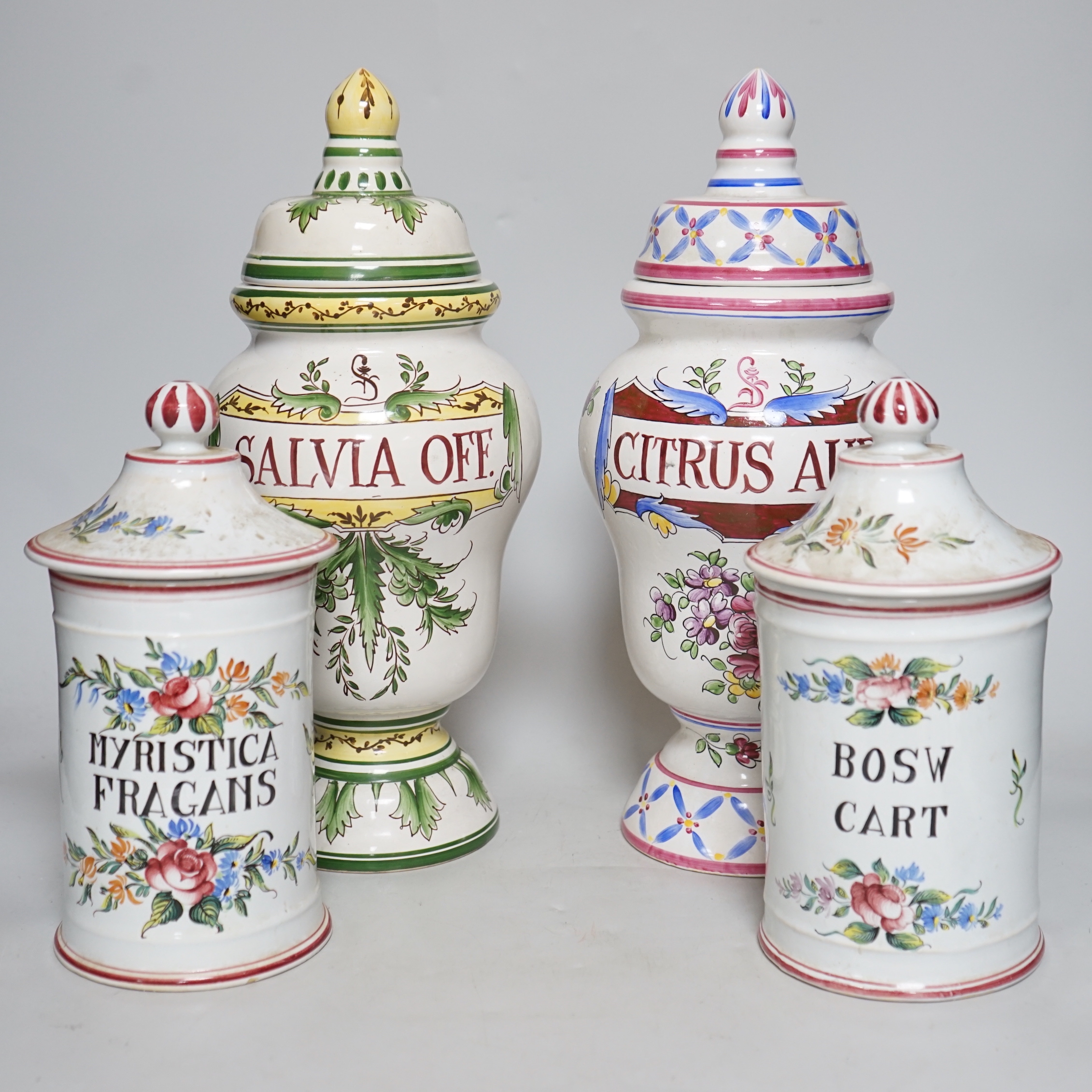 Four French polychrome faience drug jars, tallest 36cm high